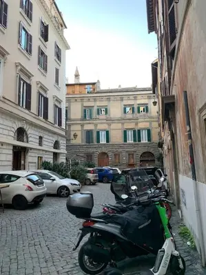 a scooter parked on a street in a city at Navona Rhome in Rome