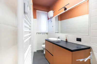 a bathroom with a sink and a toilet at LUCIANO LUXURY APARTMENT in Rome