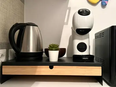 a coffee maker sitting on a table next to a coffee pot at AmoR San Lorenzo in Rome
