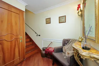 a living room with a couch and a table at 3V Luxury Apartment by Hili in Rome