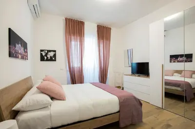 a bedroom with a bed and a television in it at Domus Ascanio by the Vatican in Rome