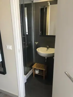 a bathroom with a sink and a glass shower at Guest House Prime Palace in Rome