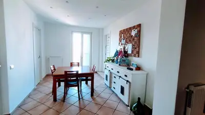 a kitchen with a table and a table and a dining room at Attic Roof Oasi Vaticana in Rome