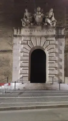 a building with a black door with a sign on it at Attic Roof Oasi Vaticana in Rome