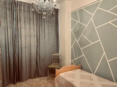 a bedroom with a bed and a chandelier at Rome Opéra Flat 2.0 in Rome