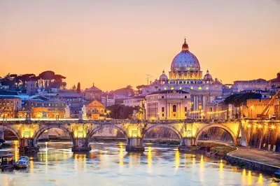 a view of a bridge over a river with a cathedral at Impero Vaticano San Pietro in Rome