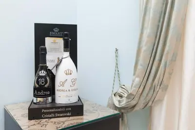 two bottles of wine sitting on top of a shelf at Impero Vaticano San Pietro in Rome