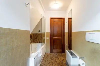 a bathroom with a tub and a sink and a toilet at The Attico: best view of Rome in Rome