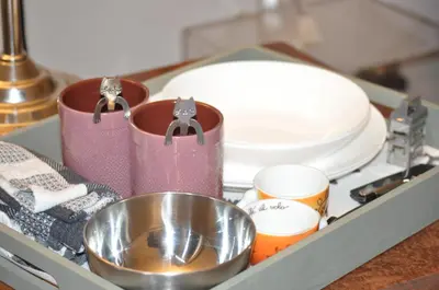 a drawer with dishes and a bowl and plates at A casa di Pelé suite in Rome