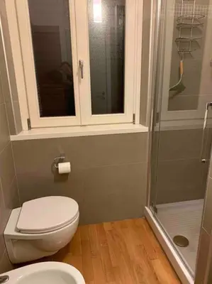 a bathroom with a toilet and a shower at In Città- appartamento a Roma con terrazzo in Rome