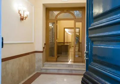 an entrance to a building with a blue door at Via Veneto Luxury Loft in Rome