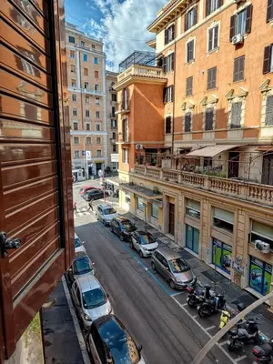 an aerial view of a city street with parked cars at ViviRome - 2 Bedrooms Apartment - San Giovanni in Rome