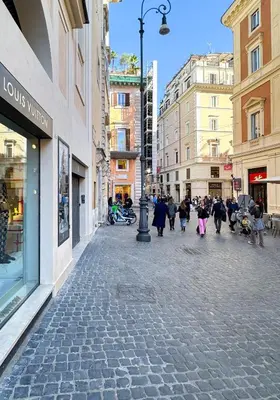 a group of people walking down a city street at Migliori Collection Penthouse in Rome