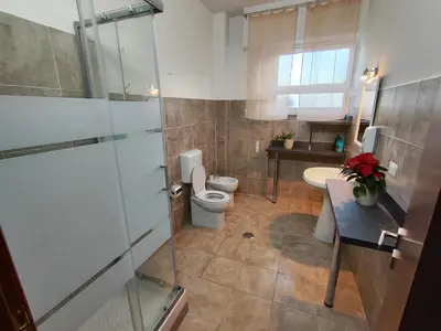 a bathroom with a toilet and a sink at B&B Bella Garbatella in Rome