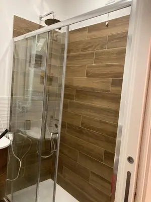 a shower with a glass door in a bathroom at Welcome to Rome Baldo in Rome