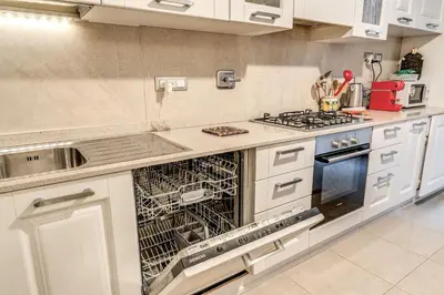 a kitchen with a dish drying rack in a dishwasher at Montebello Apartments79 in Rome
