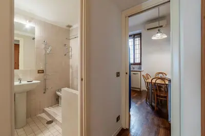 a bathroom with a shower and a sink and a toilet at A stone’s throw from the Colosseum! in Rome