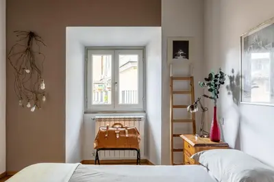 a bedroom with a bed and a window at iFlat Homey in Campo de'Fiori in Rome