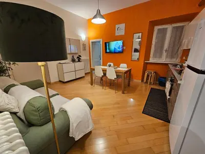 a living room with a couch and a table at Domus Ottaviano - Vaticano in Rome