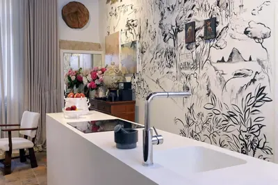 a kitchen with a sink and a wall mural at The Eclectic Home of Collector - Navona Square in Rome
