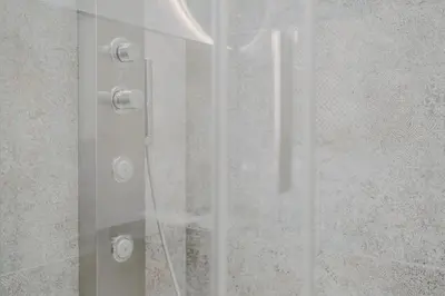a shower with a glass door in a bathroom at Domus Æterna - Re di Roma in Rome
