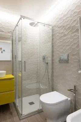 a bathroom with a shower with a toilet and a sink at Vatican 2BR apartment in Roma in Rome