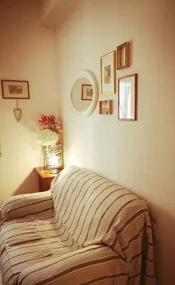 a bedroom with a bed and a table with a lamp at Porta Maggiore GH Locazione Turistica in Rome