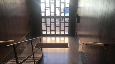 a stairway with a door and a window in a building at Porta Maggiore GH Locazione Turistica in Rome