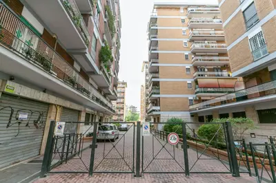 a gate in an alley between two buildings at Il rifugio dei nonni by Rentbeat in Rome
