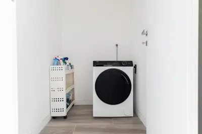 a washing machine in a room with a white wall at Sweet Rhome to Colosseum in Rome
