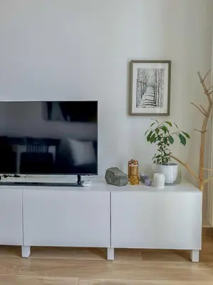 a white cabinet with a tv on top of it at Cioccis Boutique Apartment in Rome