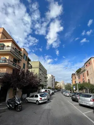 a street with cars parked on the side of the road at Cioccis Boutique Apartment in Rome
