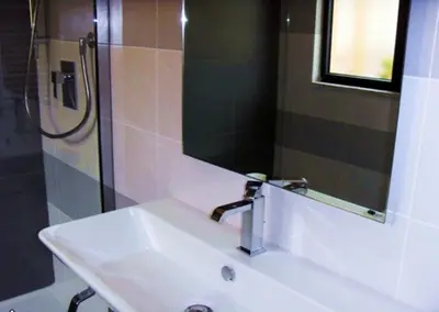 a bathroom with a sink and a mirror at Colosseum Colosseo in Rome