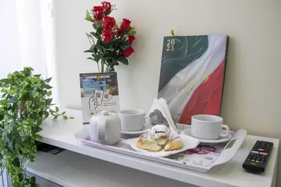 a tray with cups and saucers on a table at NINFA in Rome