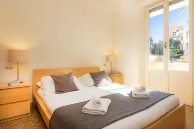 a bedroom with two beds with towels on them at Trastevere Garden by Rental in Rome in Rome