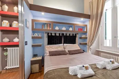 a bedroom with a bed with two towels on it at Rome as you feel - Casa Governo Vecchio in Rome
