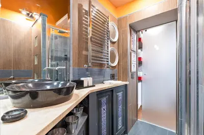 a bathroom with a large bowl sink and a shower at Rome as you feel - Casa Governo Vecchio in Rome
