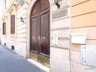 a door on the side of a building at Cairoli 2 House G&B Termini in Rome