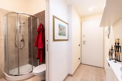 a bathroom with a shower and a toilet at Appartamento Celio in Rome