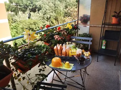 a table with a tray of food on a balcony at La verde dimora in Rome