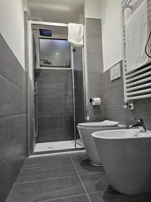 a bathroom with a shower and a toilet and a sink at Apartment Roma Centro San Pietro e Musei Vaticani in Rome