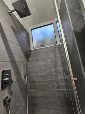 a shower with a glass door and a window at Apartment Roma Centro San Pietro e Musei Vaticani in Rome