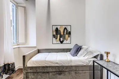 a bedroom with a bed and a window at RIPETTA234 in Rome