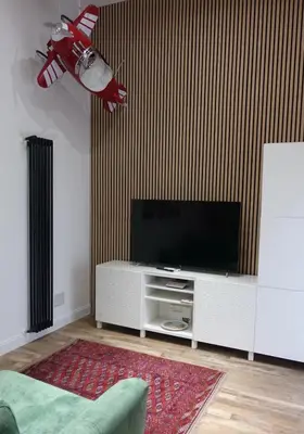 a living room with a flat screen tv at Piccolo Principe Suite in Rome