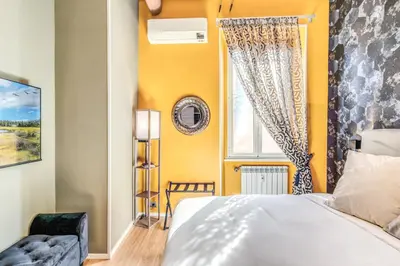 a bedroom with a bed and a window at Castel Sant'Angelo SuiteLux in Rome