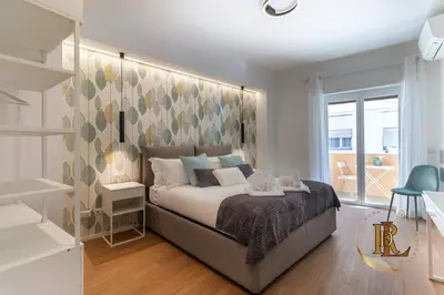 a bedroom with a bed with a large headboard at Silverius - Roma's Delightful Lodges in Rome