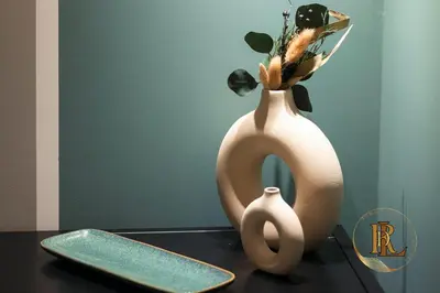 two vases with flowers in them sitting on a table at Silverius - Roma's Delightful Lodges in Rome