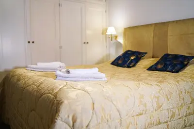 a bedroom with a bed with towels on it at Appartamento Roma centro in Rome