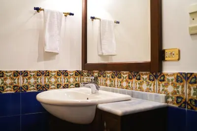 a bathroom with a white sink and a mirror at Appartamento Roma centro in Rome
