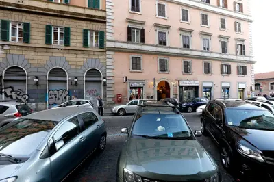 a bunch of cars parked in a parking lot at Vanella Rome Domus in Rome